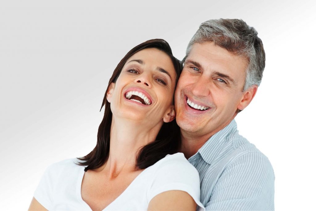Older happy couple smiling | Sexual Wellness